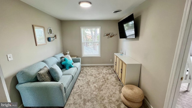 sitting room featuring carpet