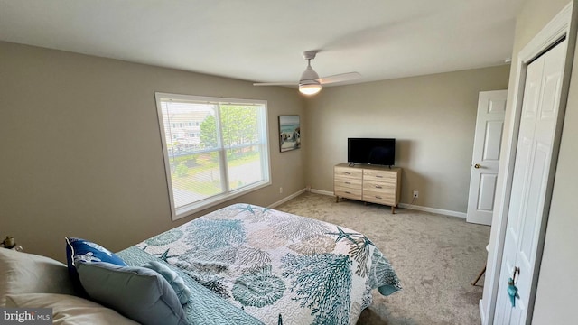 bedroom with ceiling fan and light colored carpet