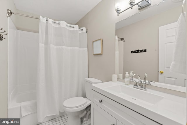 full bath featuring shower / bath combo with shower curtain, toilet, and vanity