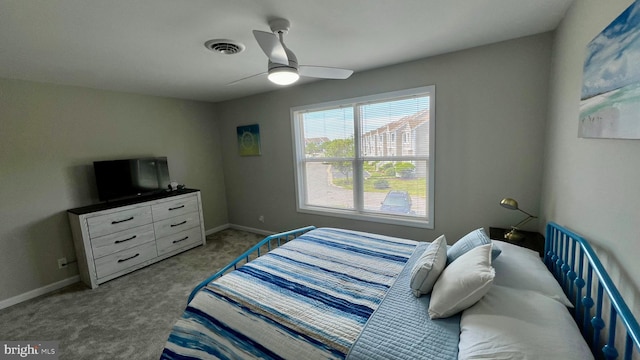 bedroom with ceiling fan and carpet floors