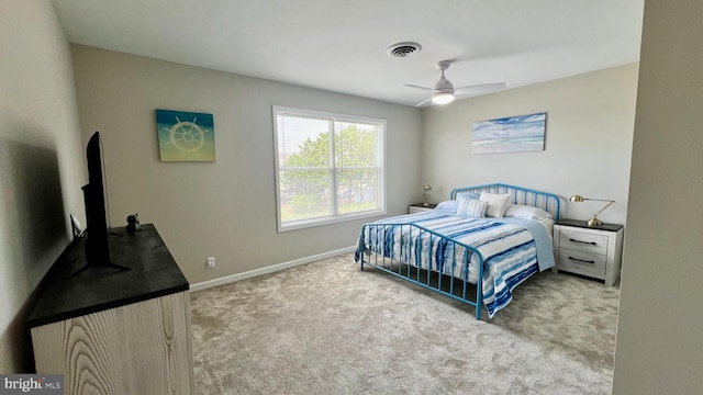 bedroom with light colored carpet and ceiling fan