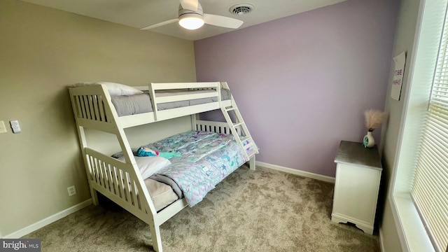 bedroom featuring light colored carpet and ceiling fan