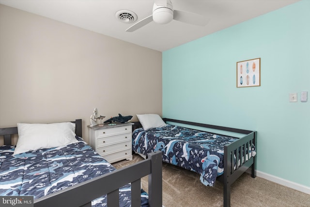 bedroom with visible vents, carpet flooring, baseboards, and ceiling fan