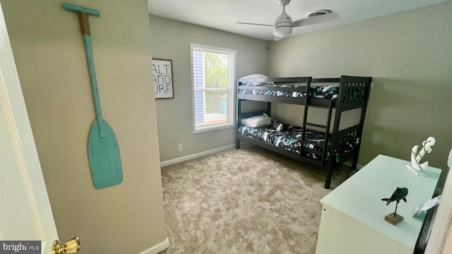 bedroom with light colored carpet and ceiling fan