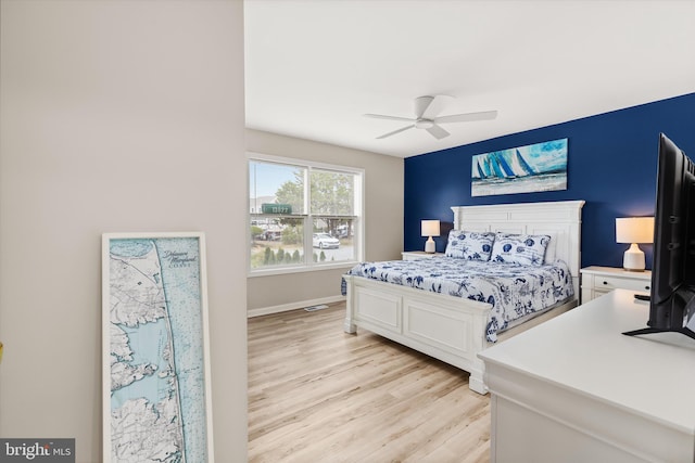 bedroom featuring ceiling fan and light hardwood / wood-style floors