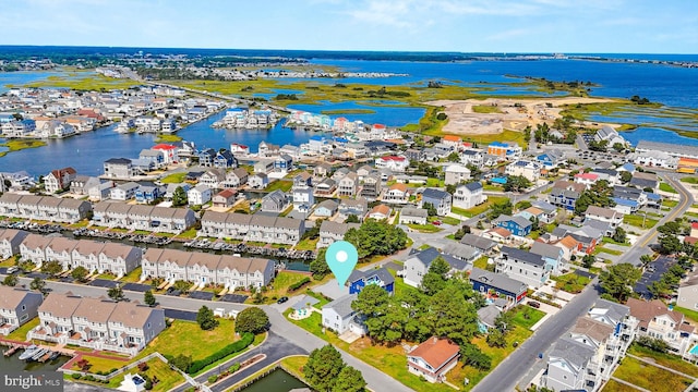 aerial view featuring a water view and a residential view