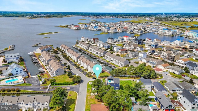 birds eye view of property featuring a residential view and a water view