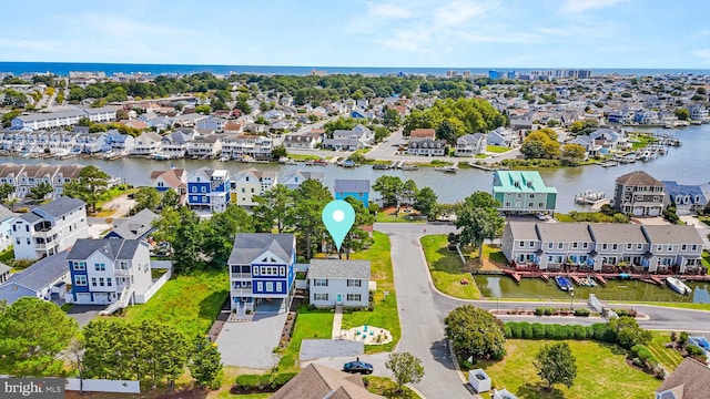 birds eye view of property featuring a residential view and a water view