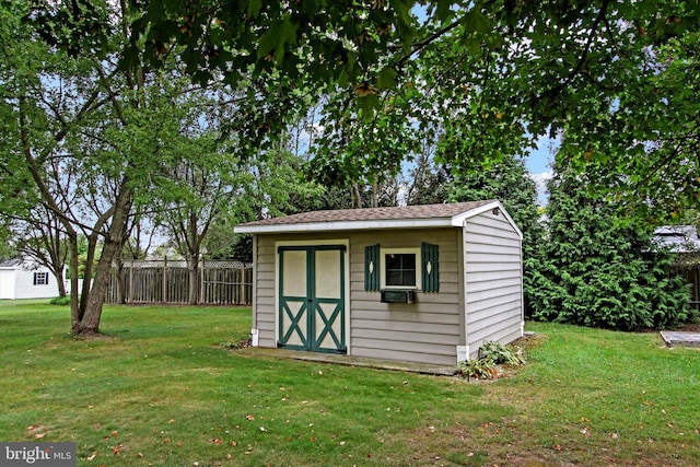 view of outdoor structure featuring a yard