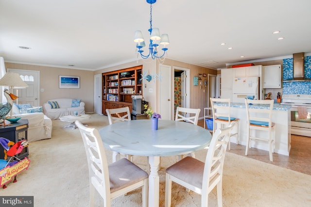 dining space with visible vents, ornamental molding, a notable chandelier, and recessed lighting