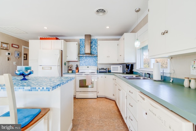 kitchen featuring wall chimney exhaust hood, sink, white cabinetry, and white appliances