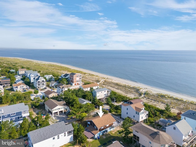 bird's eye view with a view of the beach, a water view, and a residential view