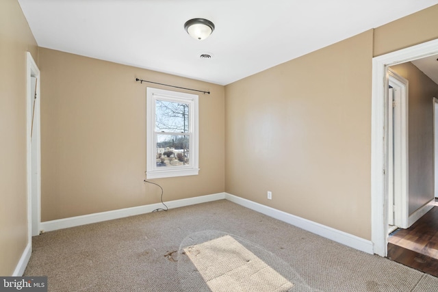 unfurnished bedroom featuring visible vents, baseboards, and carpet flooring