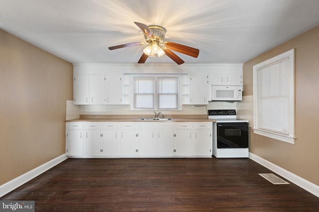 kitchen with visible vents, range with electric cooktop, a sink, baseboards, and white microwave