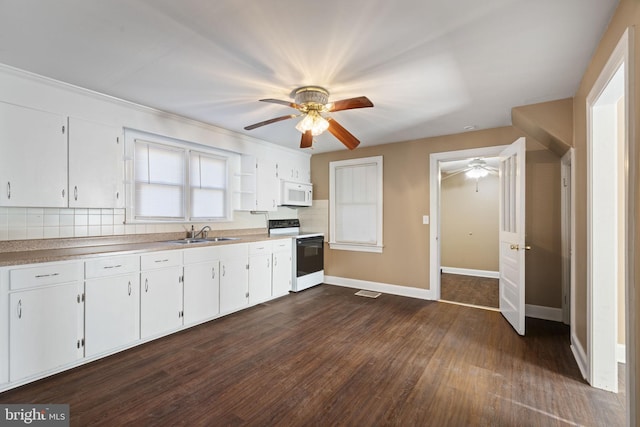 kitchen with a sink, backsplash, white appliances, a ceiling fan, and dark wood-style flooring