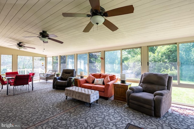 sunroom featuring ceiling fan and vaulted ceiling