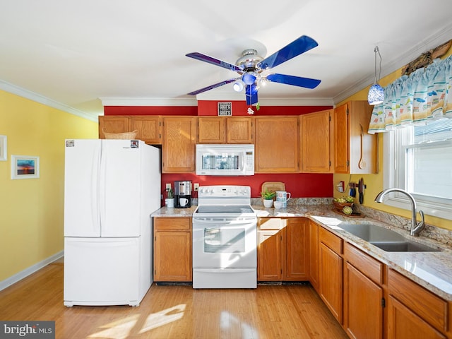 kitchen featuring crown molding, ceiling fan, sink, and white appliances