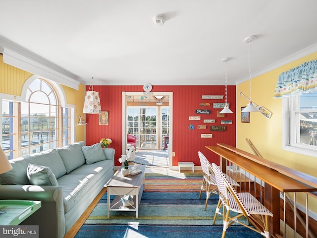 living room featuring crown molding and carpet