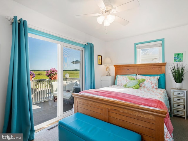 bedroom with access to outside, ceiling fan, and carpet flooring