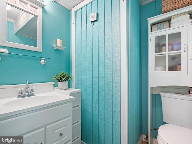 bathroom featuring toilet and vanity