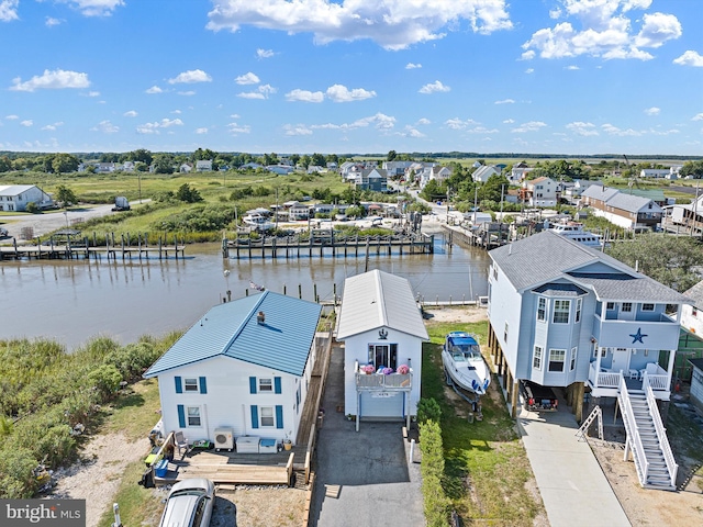 bird's eye view with a water view and a residential view