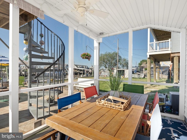 exterior space featuring ceiling fan