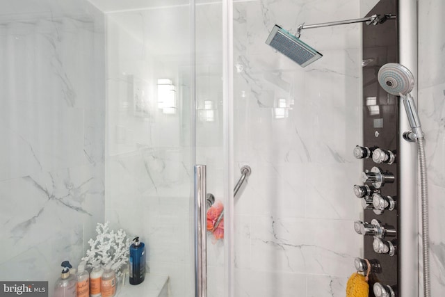 bathroom with a tile shower