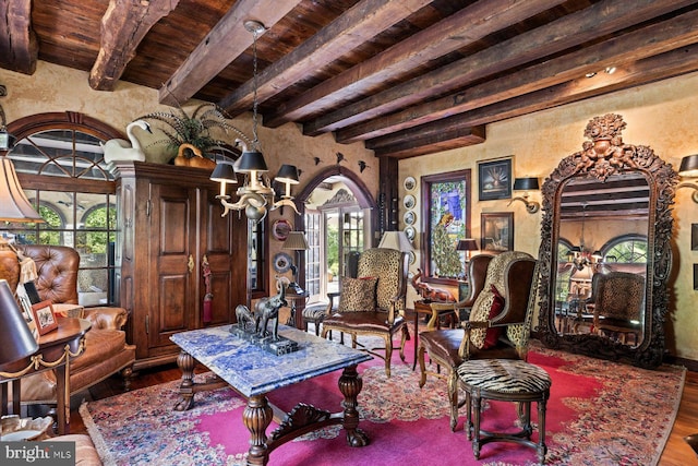 sitting room featuring beam ceiling, wooden ceiling, and wood-type flooring