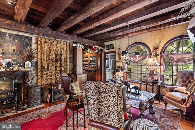 interior space with hardwood / wood-style flooring, wooden ceiling, and beamed ceiling