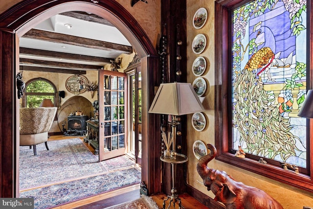 interior details with beamed ceiling and hardwood / wood-style flooring