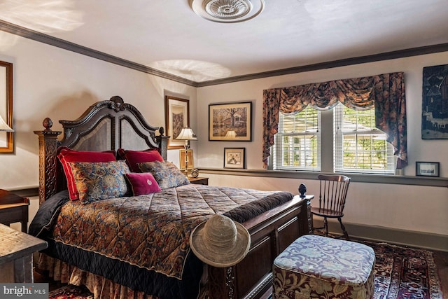 bedroom featuring crown molding