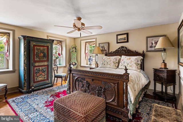 bedroom with ceiling fan and wood-type flooring