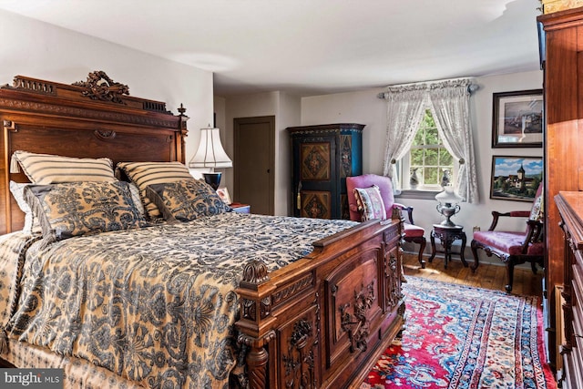 bedroom with hardwood / wood-style floors