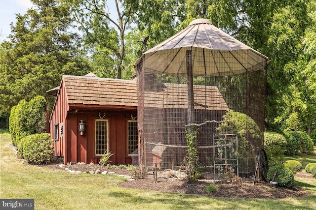 view of outdoor structure with a lawn