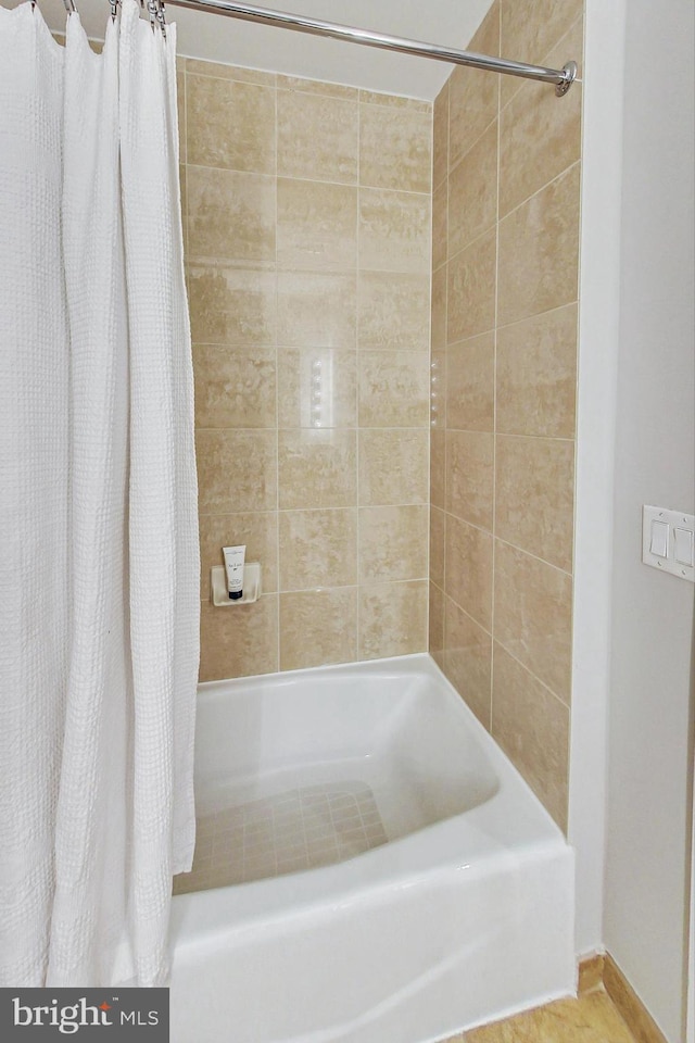 bathroom featuring shower / bath combination with curtain