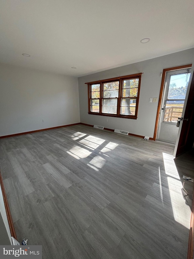 unfurnished living room featuring light hardwood / wood-style floors