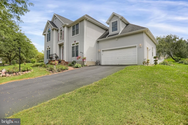 view of front facade featuring a garage and a front yard