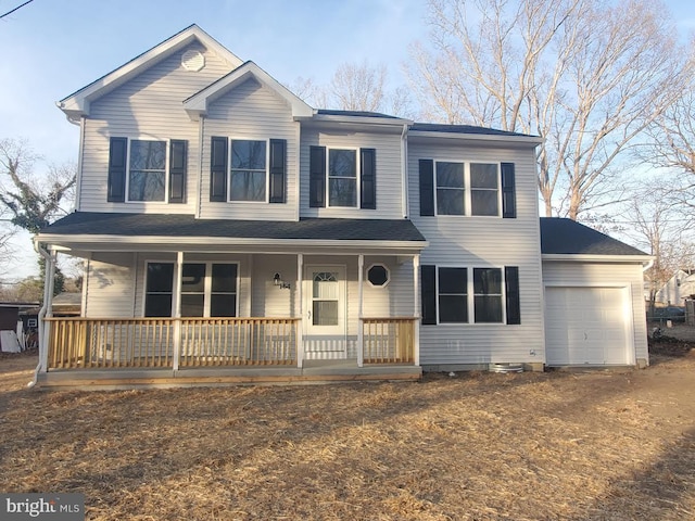 view of front of property featuring an attached garage and covered porch