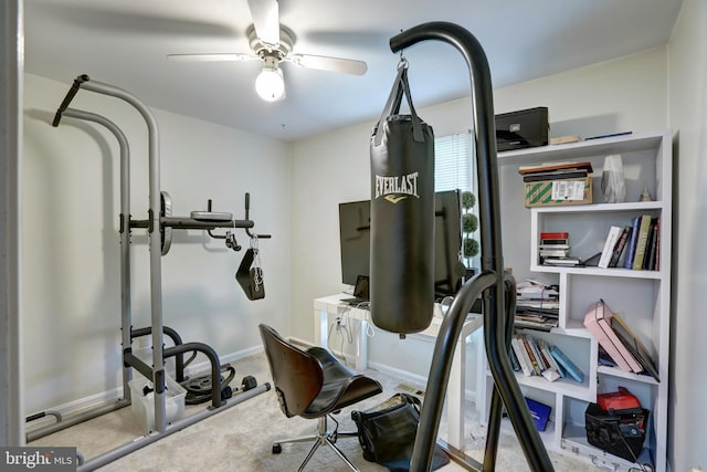 exercise room featuring ceiling fan and light carpet