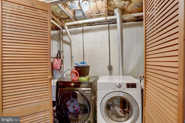 laundry room with independent washer and dryer