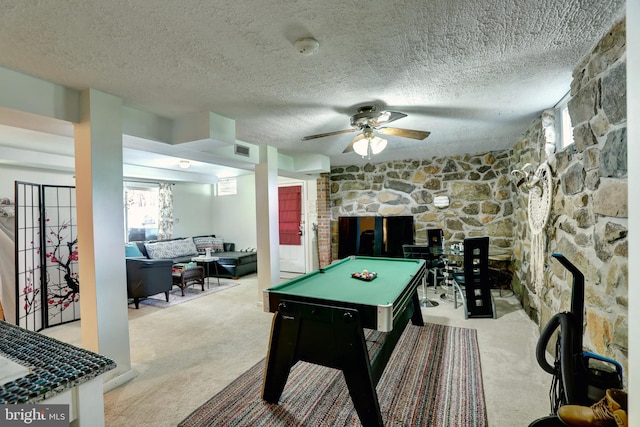 rec room with ceiling fan, a textured ceiling, light carpet, and billiards