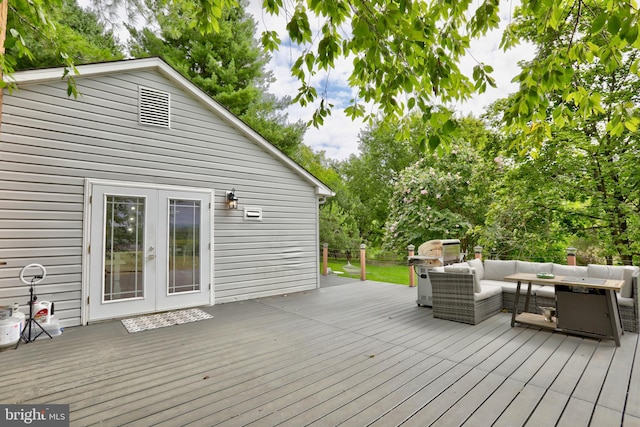 wooden deck with an outdoor living space