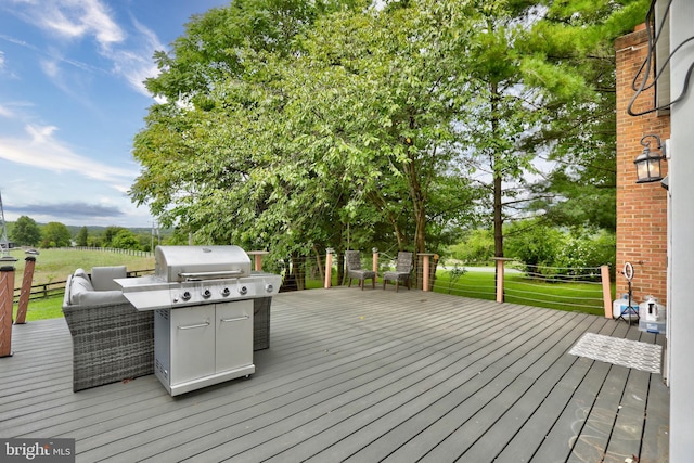 deck featuring a grill