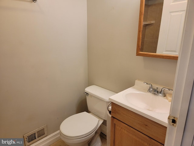 half bath featuring toilet, visible vents, and vanity