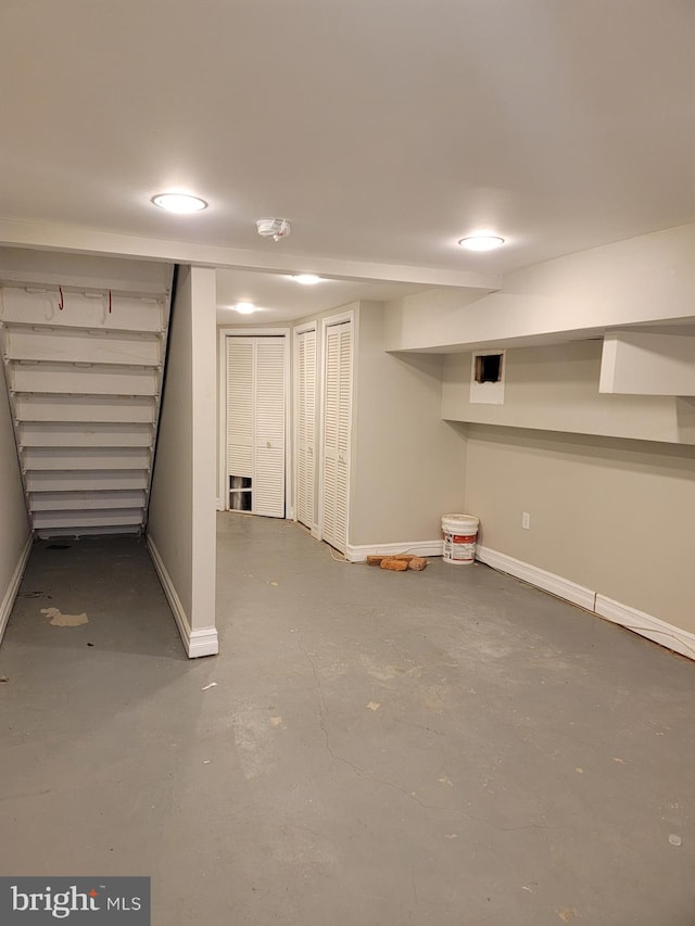 finished basement featuring baseboards