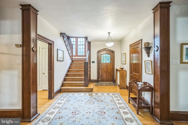 entryway with light hardwood / wood-style flooring