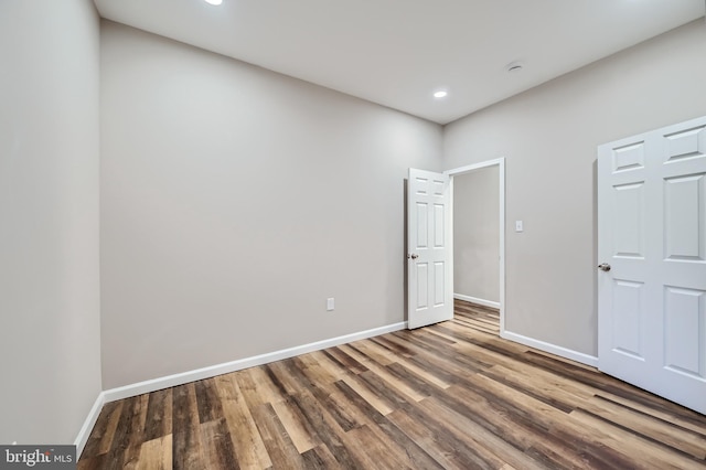 unfurnished bedroom with wood-type flooring