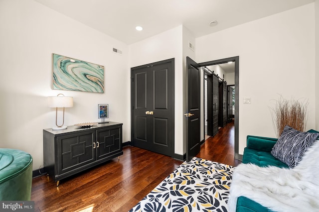 bedroom with dark wood-type flooring