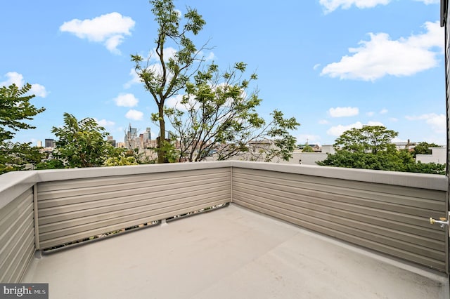 view of patio featuring a balcony