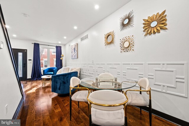 dining space with dark wood-type flooring